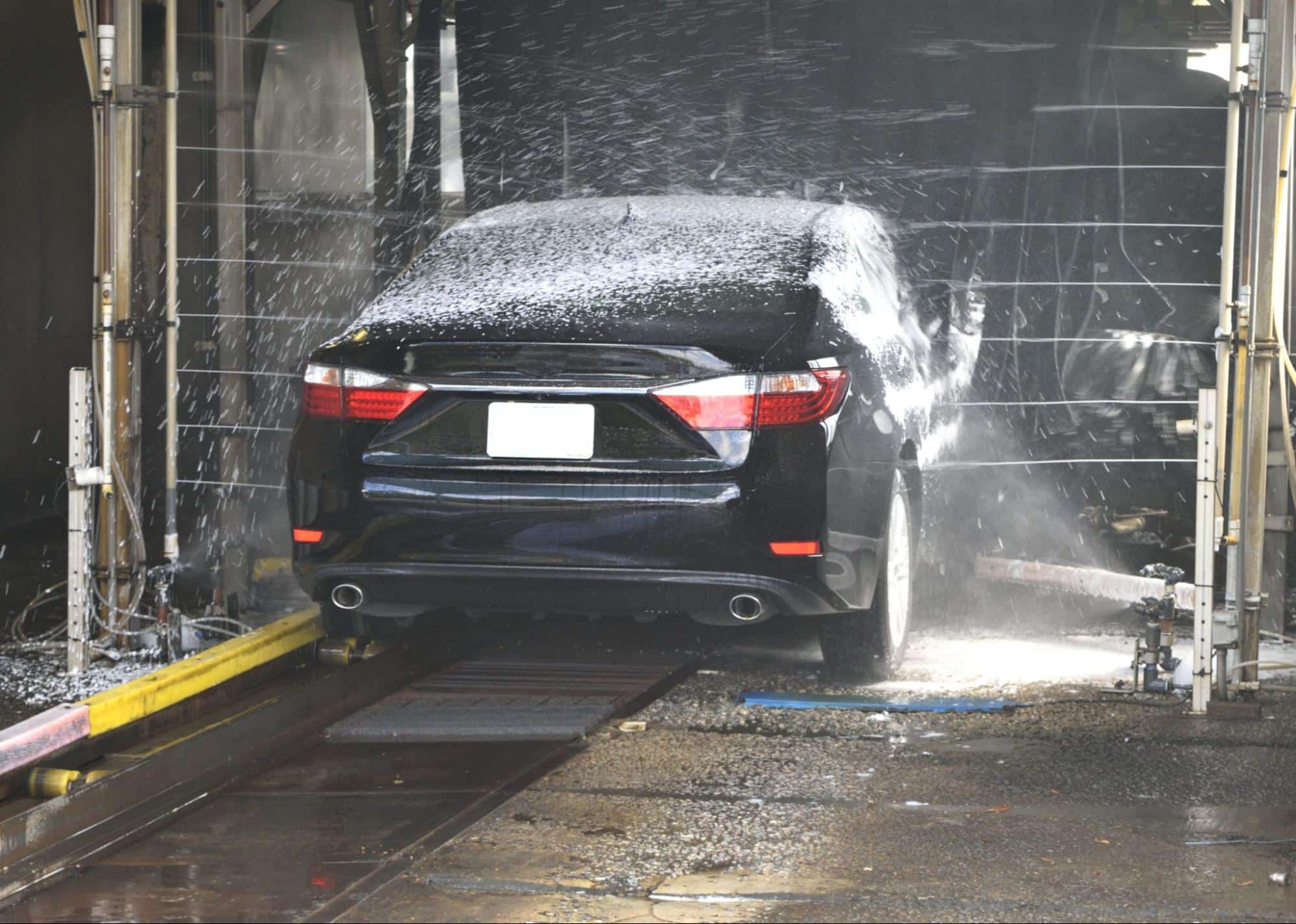 a black vehicle being washed